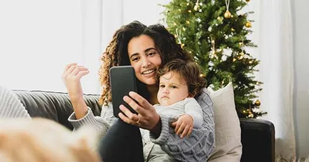 Woman video calling other co-parent