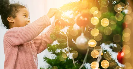 Child decorating for the holidays