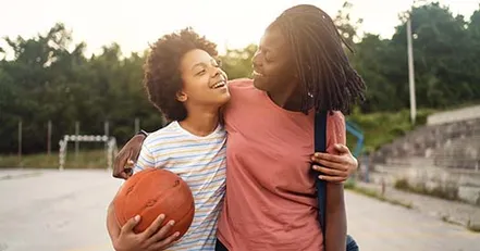 Mother and daughter playing absketball