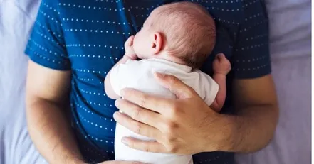 Father holding baby