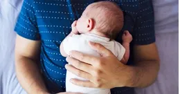 Father holding baby