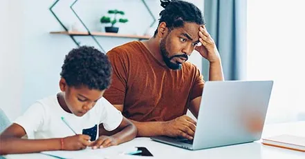 Stressed father on computer