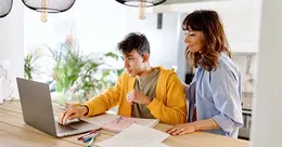 Mother teaching teenage son