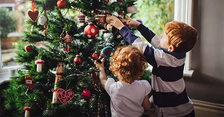 Children decorating tree