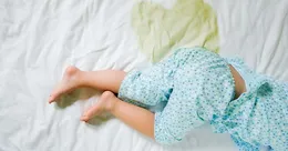 Baby that has wet the bed