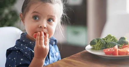 Child eating vegetables
