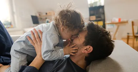 Father holding child
