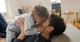 Father holding child