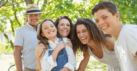 Family smiling at camera