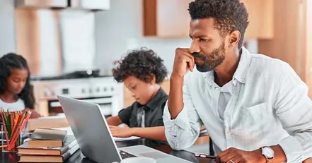 Stressed father on computer