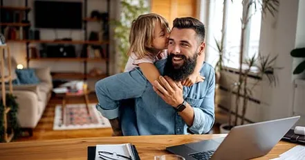 Daughter hugging father