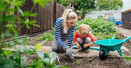 Mother and son gardening