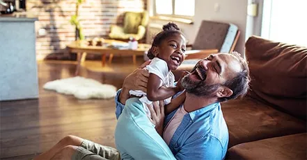 Man and girl playing