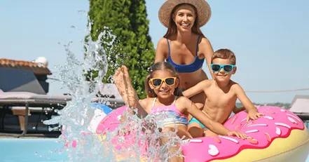 Mother and children at pool