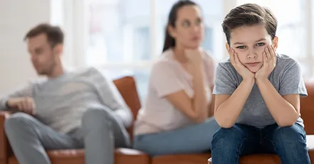 Upset child with mad parents