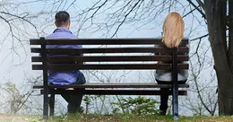 People sitting on a park bench