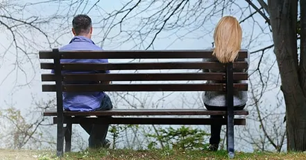People sitting on a park bench