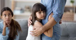 Daughter hugging father