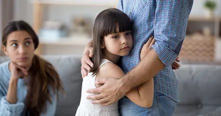 Daughter hugging father