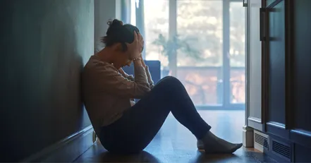 Stressed woman in a hallway