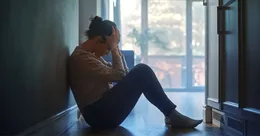 Stressed woman in a hallway