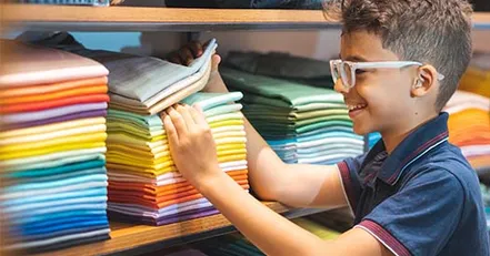 Boy shopping for a shirt
