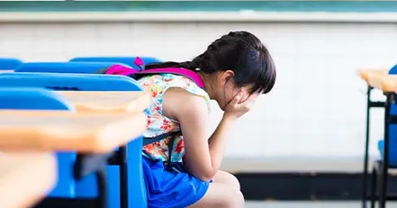 Little girl crying at school