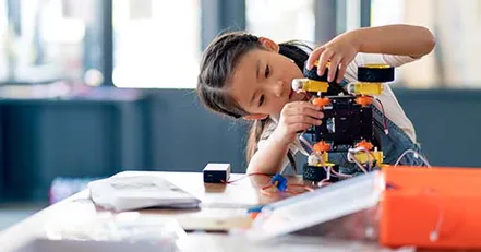 Child building a robot