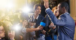 Man being interviewed by press