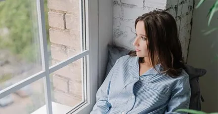 Woman looking out a window