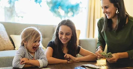 Mother giving daughters allowance
