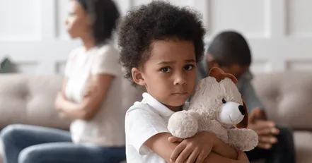 Upset child with fighting parents