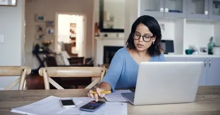Woman using calculator