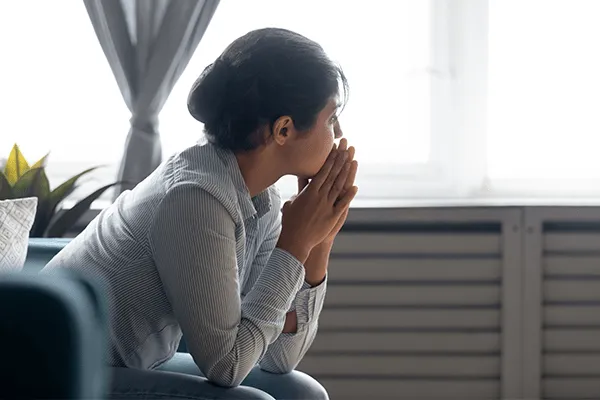 Woman looking out window